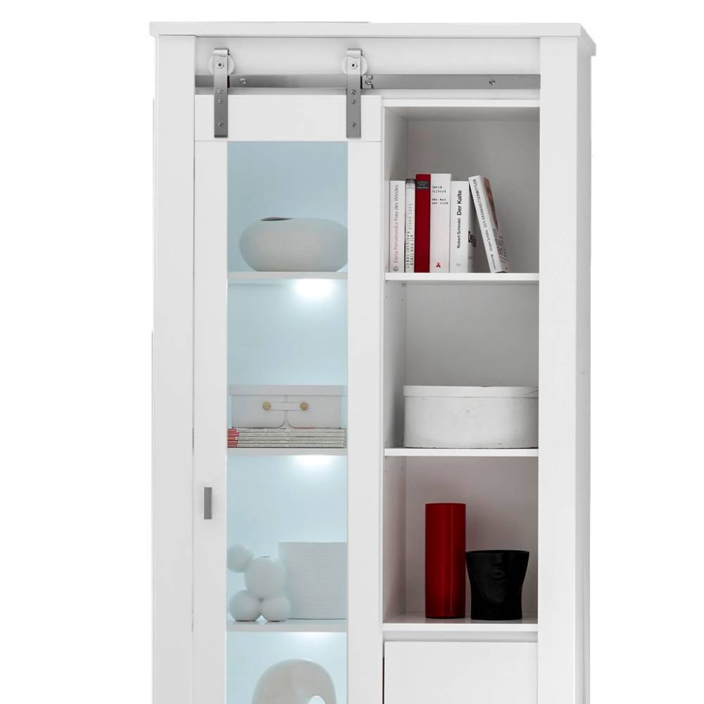 Hoher weißer Vitrinenschrank mit einer Glastür und mehreren Regalfächern für Bücher und Objekte – Memphys