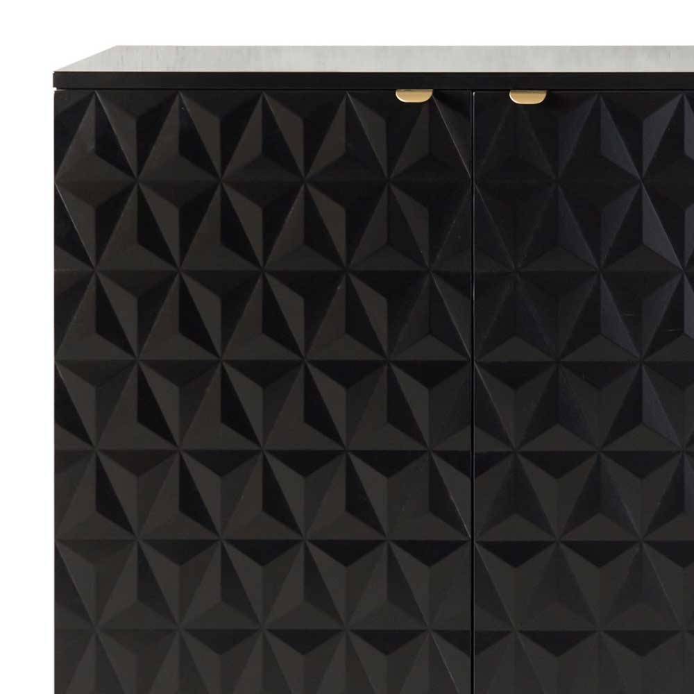 Detail der schwarzen Kommodenfronten mit geometrischem 3D-Muster und goldenen Griffen – Ardit