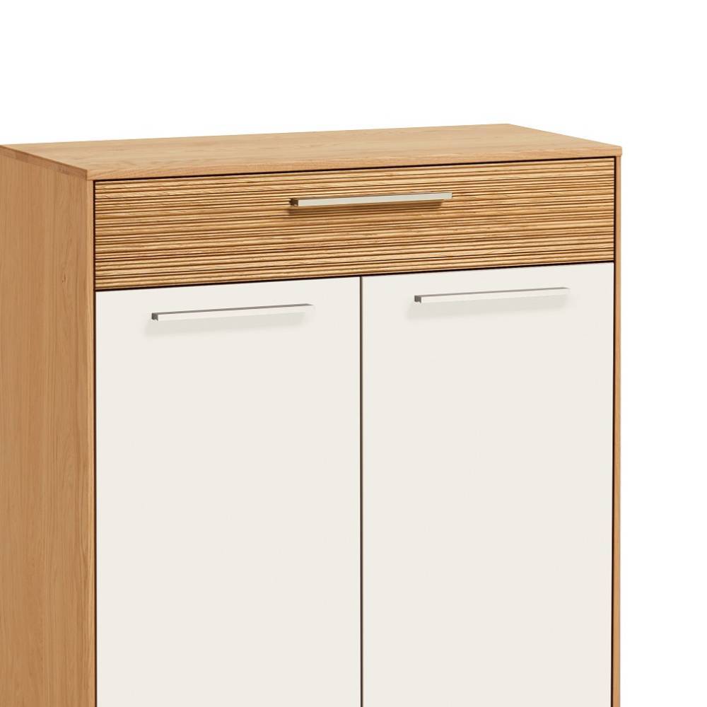 Oberer Bereich der Dielenkommode mit geriffelter Holzschublade und weißen Türen – Didesco
