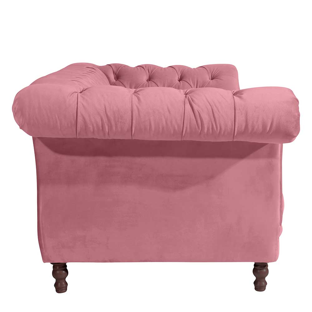 Rosa 2er Sofa mit Samtveloursbezug und Chesterfield-Steppung von der Seite – Clewono
