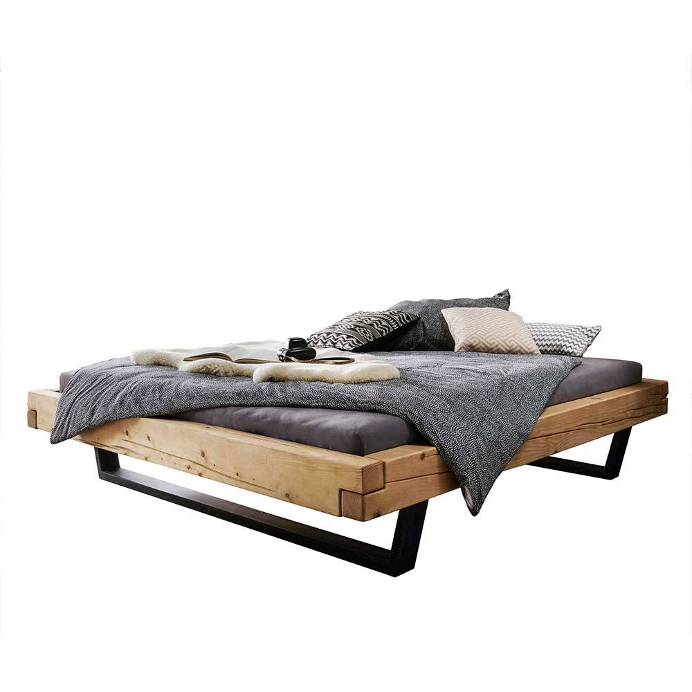 Balkenbett ohne Kopfteil aus Fichte Massivholz mit Bügelbeinen Metall Schwarz Lary