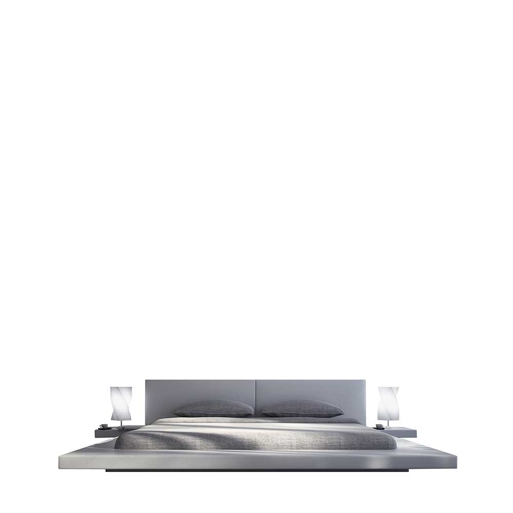 Gepolstertes Futonbett mit 22 cm Einstiegshöhe in Weiß Kunstleder mit LED Katrova