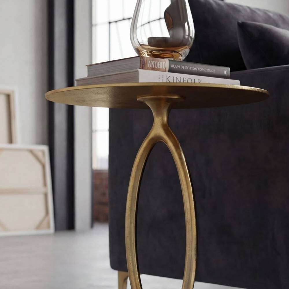 Eleganter goldener Aluminium Beistelltisch mit ovalem Gestell und runder Platte – Daroncas