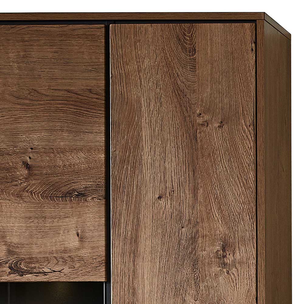 Oberer Bereich der Wohnwand-Vitrine mit zwei geschlossenen Türen im dunklen Holzdekor – Xindus
